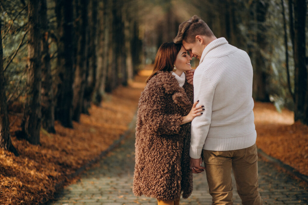 fashion couple together walking in the park
